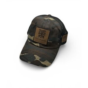 Tomahawk Live Trap Camouflage Trucker Hat with a Leather Patch.